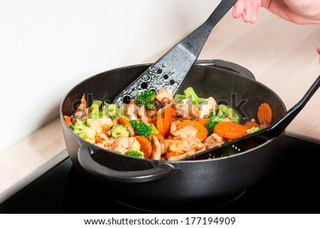 Frying vegetables and meet in fry pan