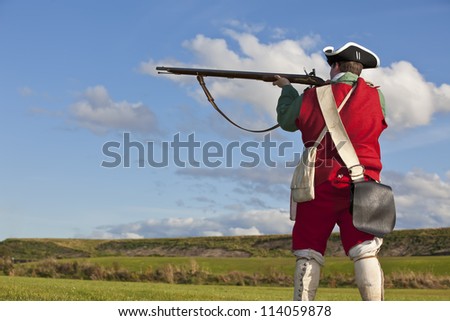 Reenactor In 18th Century British Army Infantry Redcoat Uniform Aiming ...