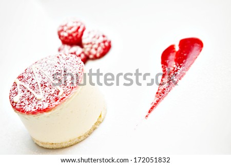Small white mousse cheese cake with raspberries. February 14th Valentine dinner dessert