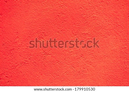 Fragment of red concrete facade wall texture