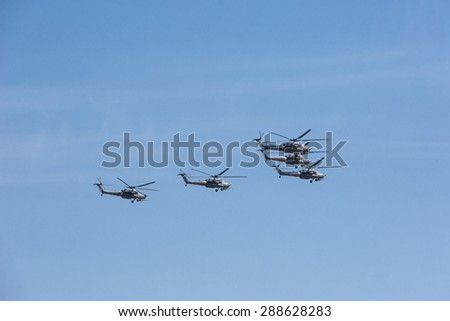 MOSCOW, RUSSIA - MAY 9: Mi-28N (Havoc) attack helicopters of aerobatic team Berkuty fly on military parade devoted to 70th anniversary of Victory Day in WWII in Europe aka The Great Patriotic War.