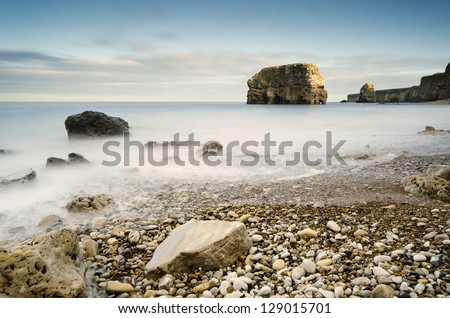 Marsden Rock in smooth water / Marsden Bay rocks and stacks are the result of erosion over many years