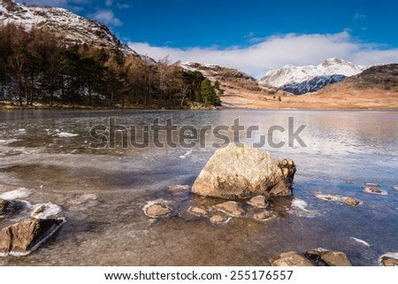 Frozen Blea Tarn / Blea Tarn is a remote  small lake among the Langdale Fells in the Lake District