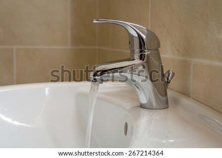 Bathroom sink tap with running water / Single lever monobloc chrome mixer tap on bathroom sink