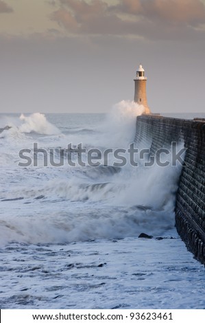 Tynemouth north pier with waves / Waves crashing against Tynemouths pier and lighthouse