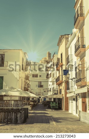 Typical street in old town of Ibiza, in Balearic Islands, Spain, with a retro effect