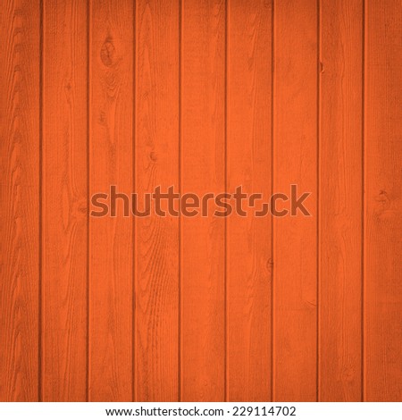 Horizontal orange wooden fence close up