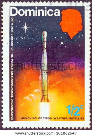 DOMINICA - CIRCA 1973: A stamp printed in Dominica issued for the centenary of the World Meteorological Organization shows the launching of weather satellite, circa 1973.