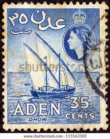 ADEN COLONY - CIRCA 1953: A stamp printed in United Kingdom shows a dhow and Queen Elizabeth II, circa 1953.