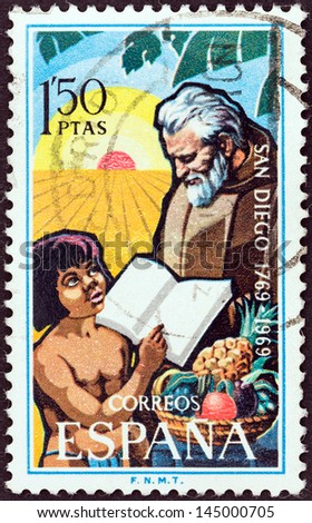 SPAIN - CIRCA 1969: A stamp printed in Spain issued for the bicentenary of San Diego, California shows Franciscan Friar and child, circa 1969.