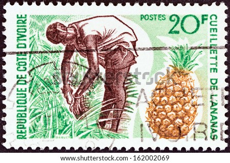 IVORY COAST - CIRCA 1967: A stamp printed in Ivory Coast shows Pineapple Harvest, circa 1967.