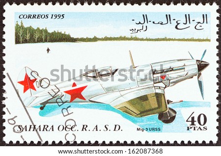 WESTERN SAHARA - CIRCA 1995: A stamp printed in Western Sahara shows a  MiG-3 aircraft, USSR, circa 1995.