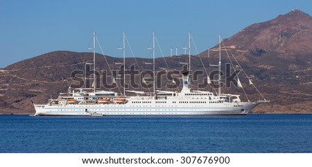 MILOS ISLAND, GREECE - AUGUST 18, 2015: Cruise ship Club Med 2 anchored in Milos bay. Club Med 2 is 194 m long, one of the largest sailing cruise ships in the world, carrying up to 386 passengers.