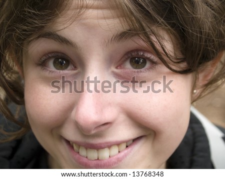 Young girl, happy face. Brown eyes and beautiful smile.
