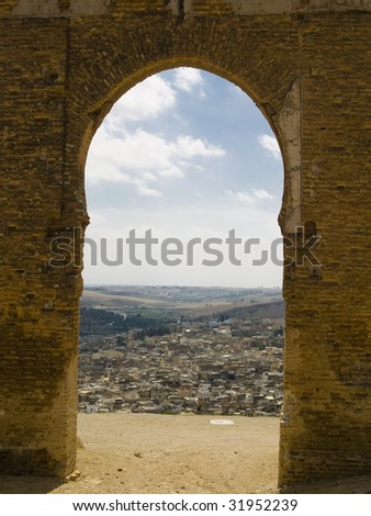 Old gate on the hill in backgroud Fes city, Morocco