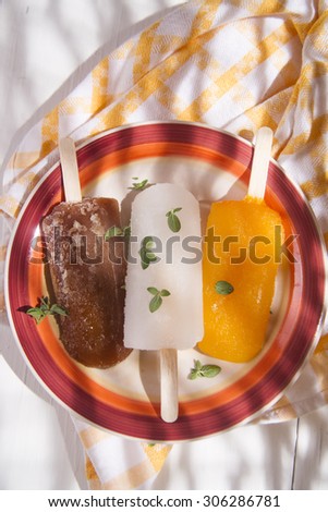 Presentation of three icicles summer fruit on colorful plate