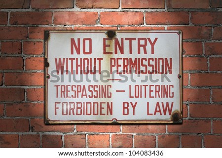 stock photo : Old and aged no entry without permission sign, spotlighted and afixed to brick wall. / No Entry Without Permission Sign / Heavy duty warning.