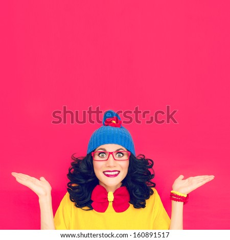 Funny portrait a girl on a crimson background