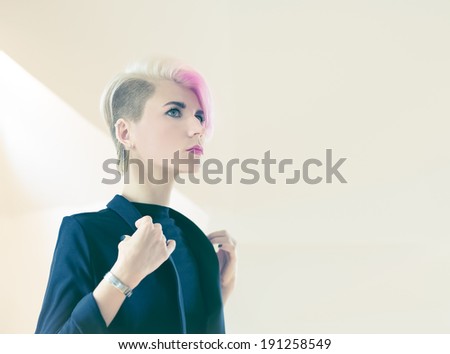 Fashion portrait of a girl with stylish haircut