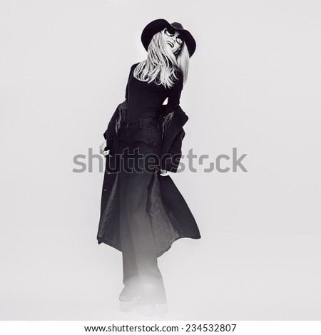 Happy Glamorous Lady in Coat and Hat. Black and white Vintage style