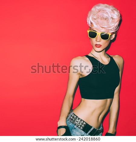 Crazy disco punk Girl on red background. Hot party
