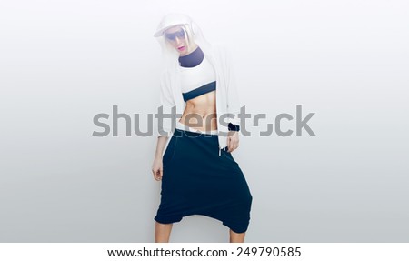 Slim Girl dancer on white background. Daylight. Movement, lifestyle, Sportswear