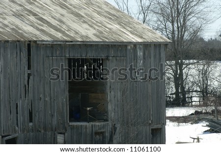 Deserted barn on a empty field