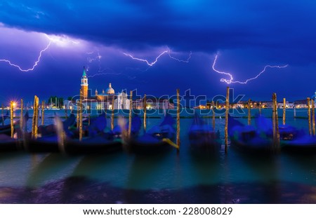 Thunderstorm with lightning in the sky on the Grand Canal in Venice, Italy