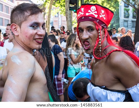MADRID, SPAIN - JULY, 6: People participating at the Gay Pride parade on July 6, 2013 in Madrid (Spain). Near 1,200,000 people from all over the world participated at the Gay Pride Parade in Madrid.