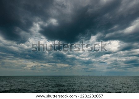 Similar – Foto Bild Sturmwolken über einem goldenen Kornfeld.