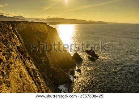 Similar – Foto Bild Sonnenuntergang über felsiger Meeresküste