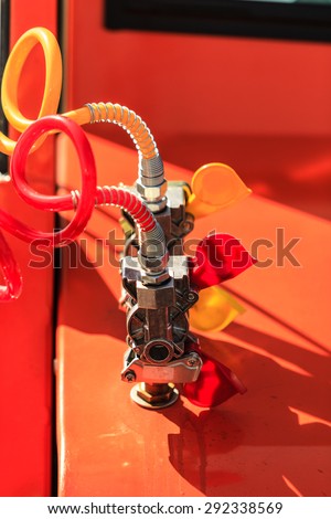 Closeup red yellow air connections hoses of machinery industrial detail