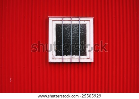 Red wall and white window with anti-theft protection