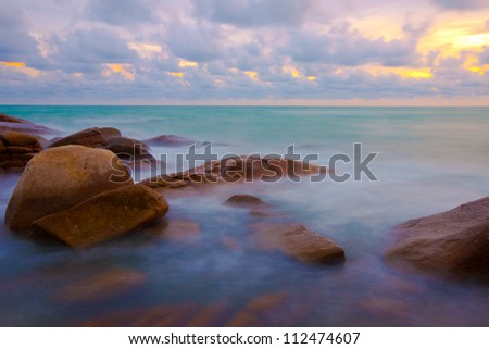 stone and waves during sundown. Natural composition
