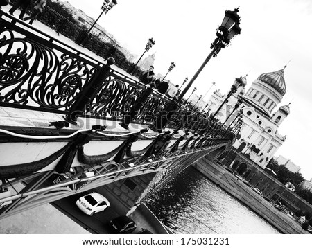 Black and white photography, monochrome,. Cityscape. Russian traditional architecture. The Cathedral and the bridge over the river. Christianity, Orthodox culture