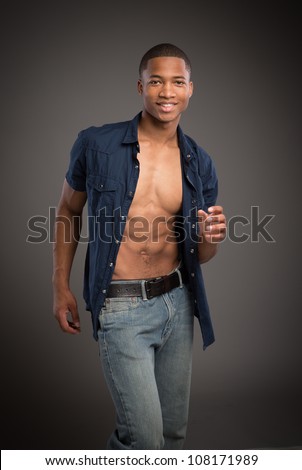 Casual Dressed Young African American Male Model Natural Looking on Grey Background