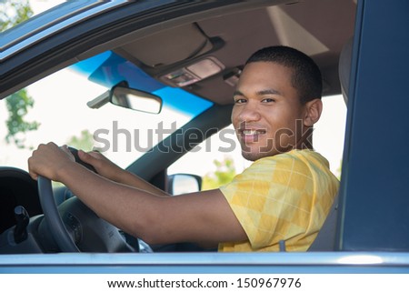 Young Smiling African American Male in Driver Seat Car