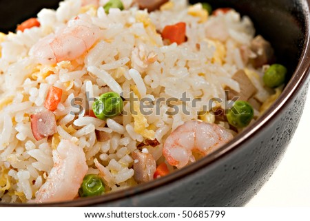 Closeup Bowl of Shrimp Stir Fry Rice, Traditional Chinese Food, Dark Bowl