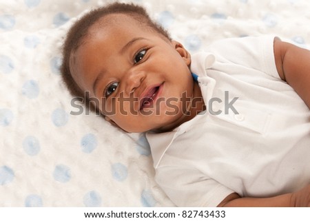 happy 6-month old African American baby boy portrait
