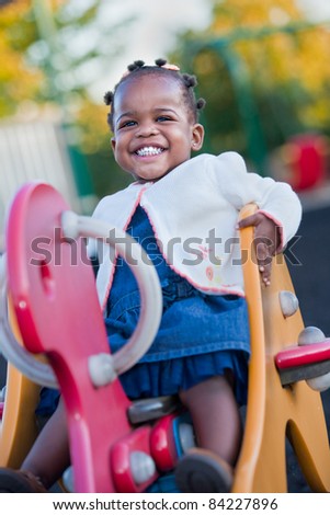 3-year old African American Girl Playing in the Playground