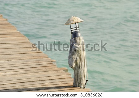 Lamp on Wooden pier on summer season - Wooden pier in Kho mak, Thailand