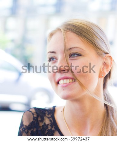 Woman Joyful in a Cafe