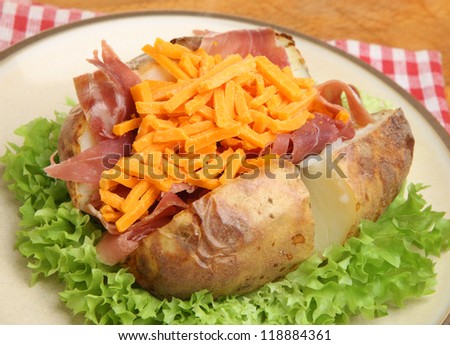 Jacket potato with Parma ham and grated cheese.