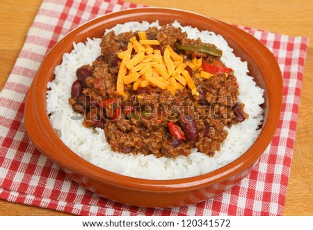 Chilli with rice and cheese in a terracotta dish