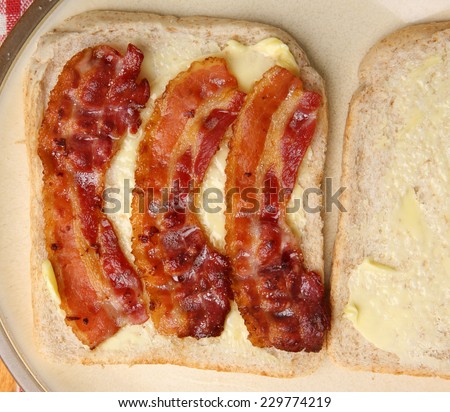 Bacon sandwich on buttered wholewheat bread.