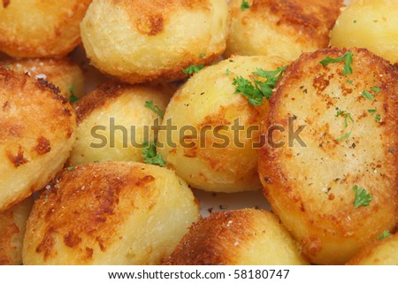 Roast potatoes seasoned with rock salt and ground pepper.