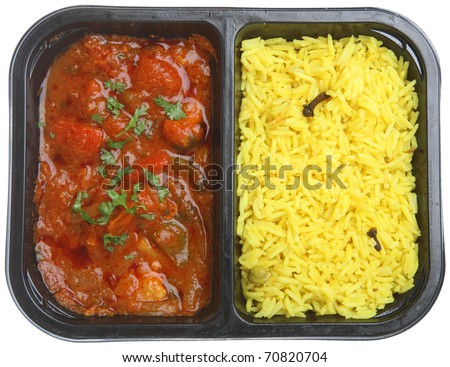 Indian chicken curry with rice in supermarket packaging tray.