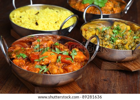 Indian chicken jalfrezi with rice and vegetable curry.