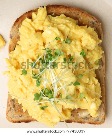 Scrambled eggs on toast topped with cress