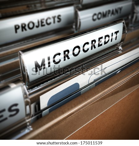 Folder with focus on a tab and the word microcredit, blur effect. Concept of company projects funding.